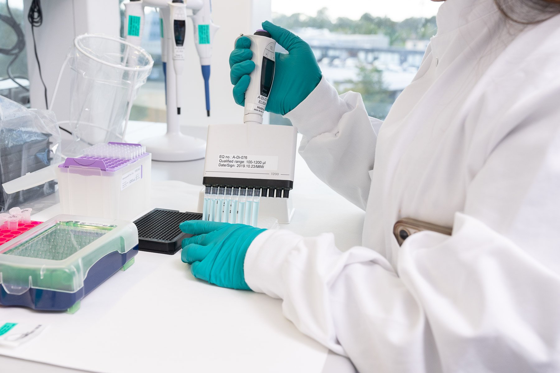 Lab tech working with cells.
